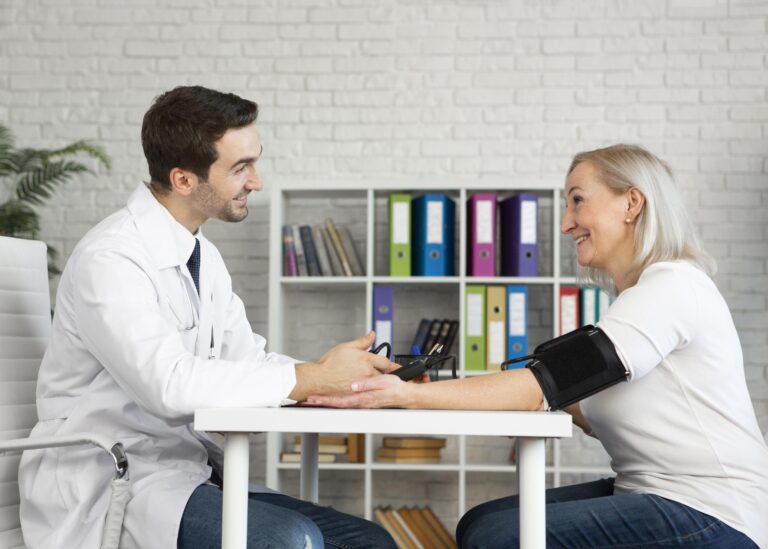 Doctor checking a patient’s blood pressure during a health checkup